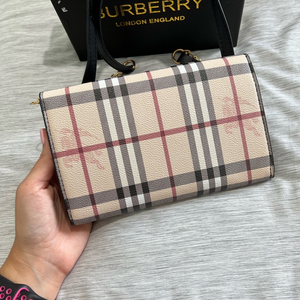 Cross body purse. Plaid print. Never used. Smoke free. Pet free home.